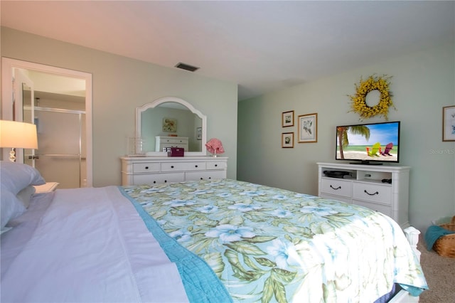 bedroom with carpet and a walk in closet