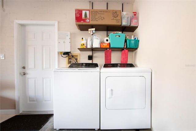 washroom with washing machine and dryer