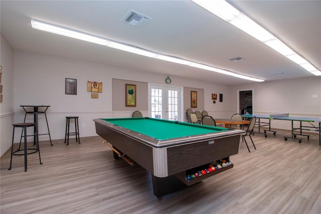 recreation room with french doors, light hardwood / wood-style floors, and pool table