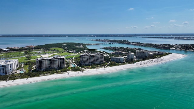 bird's eye view with a beach view and a water view