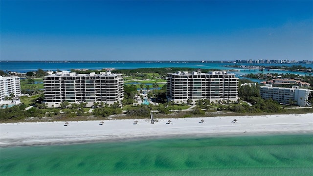 bird's eye view featuring a beach view and a water view