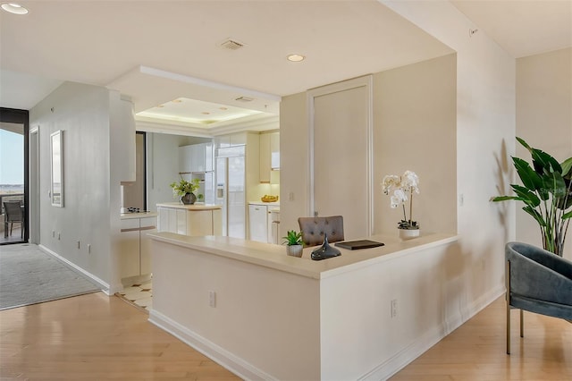 415 L Ambiance Dr Unit C703, Longboat Key, FL 34228 - hallway with light wood-type flooring, baseboards, recessed lighting, and a tray ceiling