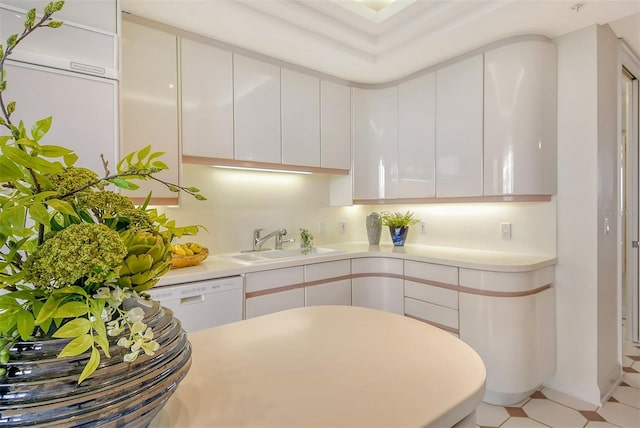 415 L Ambiance Dr Unit C703, Longboat Key, FL 34228 - kitchen with a sink, light countertops, white cabinetry, dishwasher, and modern cabinets