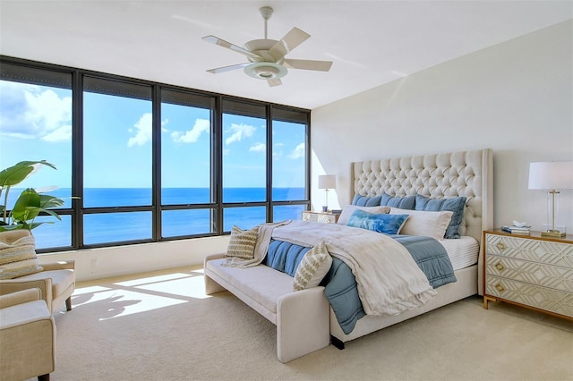 415 L Ambiance Dr Unit C703, Longboat Key, FL 34228 - carpeted bedroom featuring a water view and a ceiling fan