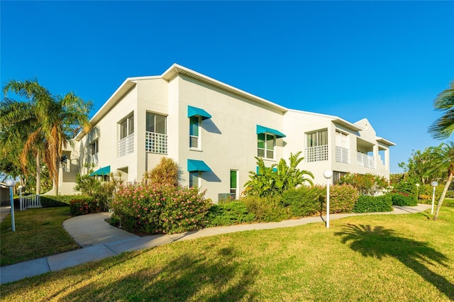 view of home's exterior featuring a lawn