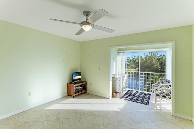 doorway featuring ceiling fan