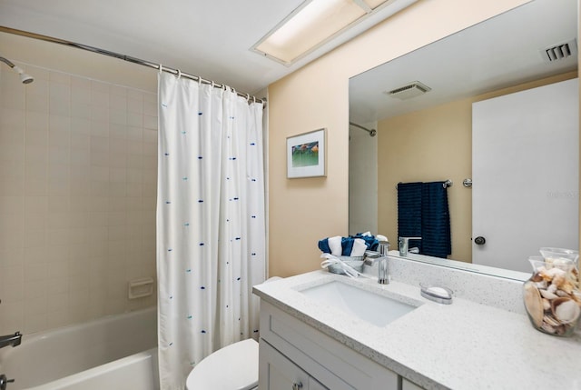 full bathroom featuring shower / bathtub combination with curtain, vanity, and toilet