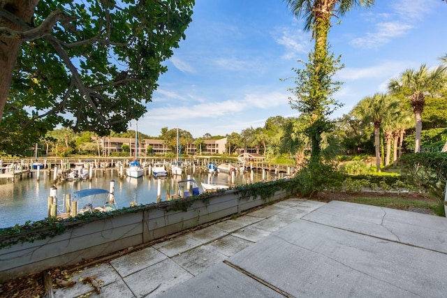 exterior space with a water view and a dock