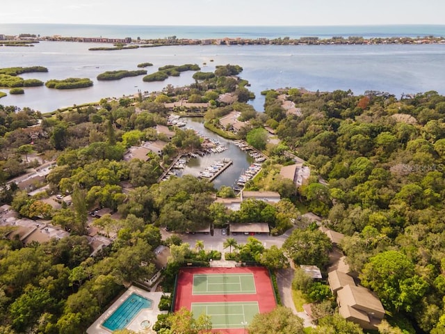 birds eye view of property with a water view