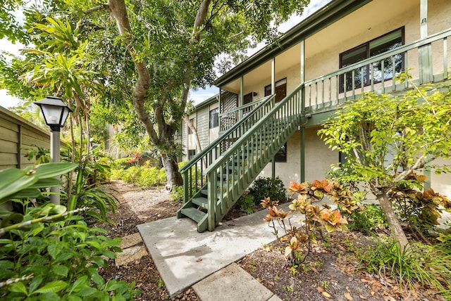 1519 Pelican Point Dr Unit 292, Sarasota, FL 34231 - view of home's community featuring a patio and stairs