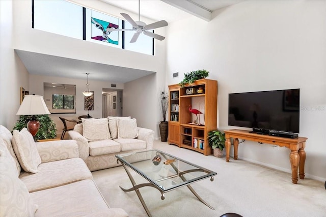 1519 Pelican Point Dr Unit 292, Sarasota, FL 34231 - living area with ceiling fan, carpet, and a high ceiling