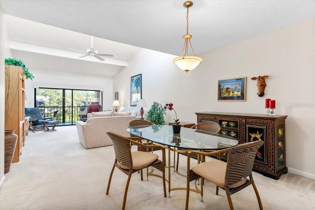 1519 Pelican Point Dr Unit 292, Sarasota, FL 34231 - dining space featuring light colored carpet, a ceiling fan, and vaulted ceiling