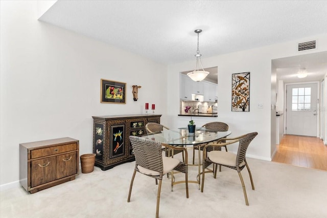1519 Pelican Point Dr Unit 292, Sarasota, FL 34231 - dining room with light colored carpet and baseboards