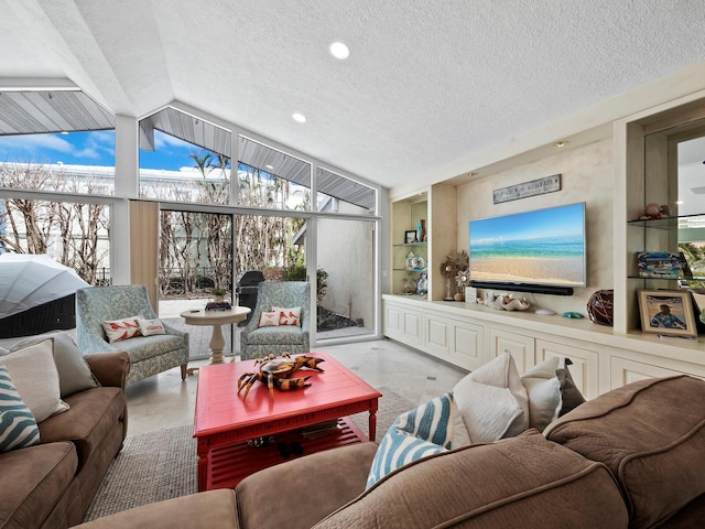 living room featuring a textured ceiling, vaulted ceiling, and a wall of windows