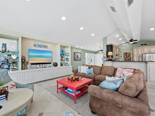 living room with ceiling fan, light tile patterned flooring, and lofted ceiling