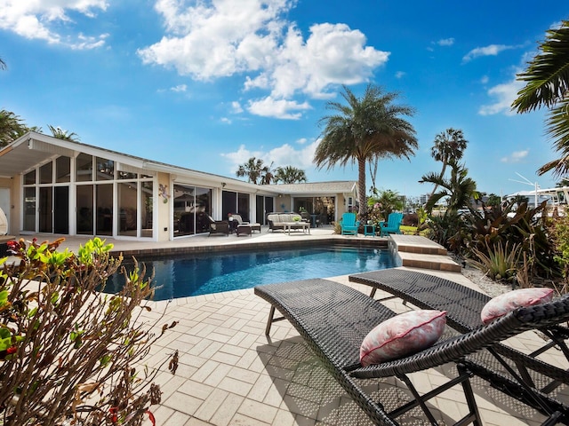 view of pool featuring a patio area