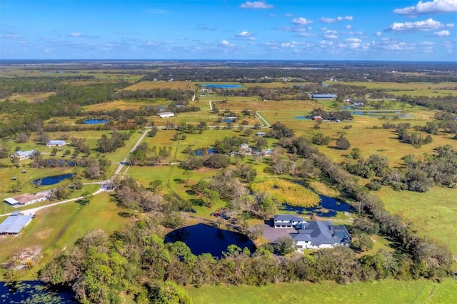 bird's eye view with a water view and a rural view