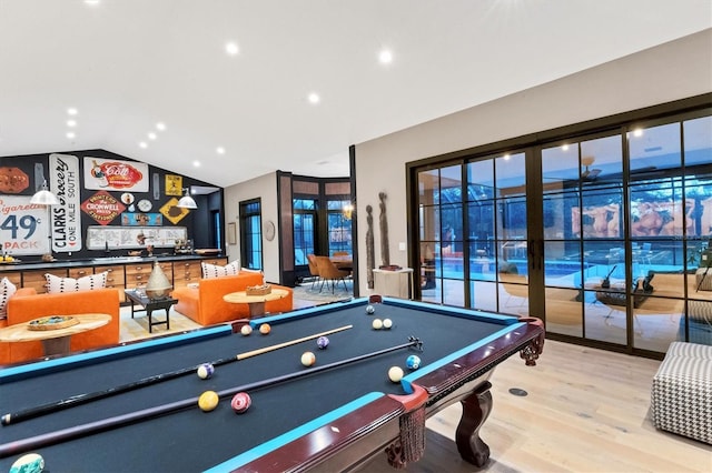 playroom featuring hardwood / wood-style flooring and vaulted ceiling