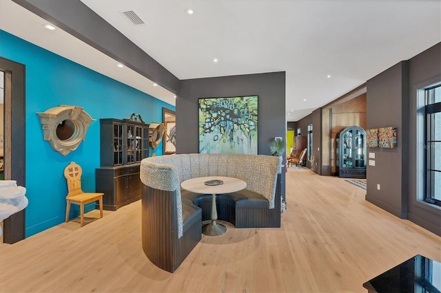 dining room featuring plenty of natural light and light hardwood / wood-style floors