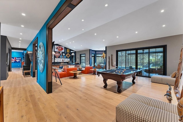 rec room featuring vaulted ceiling, a wealth of natural light, pool table, and light wood-type flooring