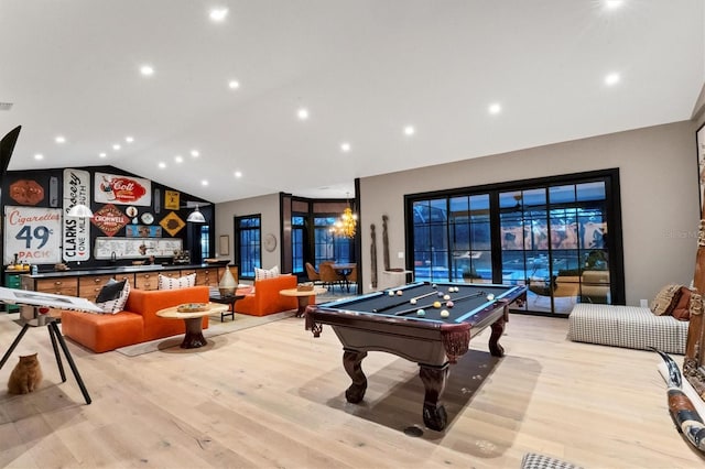 rec room with vaulted ceiling, light hardwood / wood-style floors, and billiards