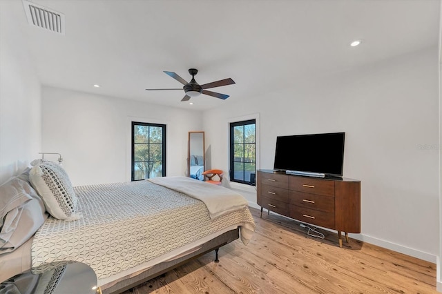 bedroom featuring light hardwood / wood-style floors and ceiling fan