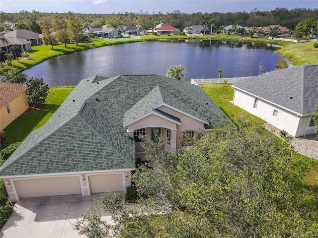 bird's eye view featuring a residential view and a water view