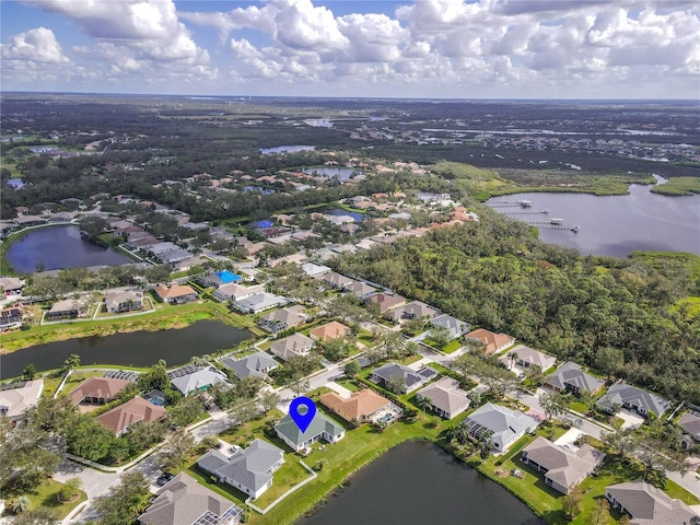 aerial view featuring a water view and a residential view