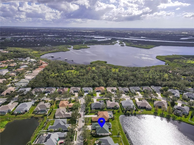 aerial view featuring a residential view and a water view