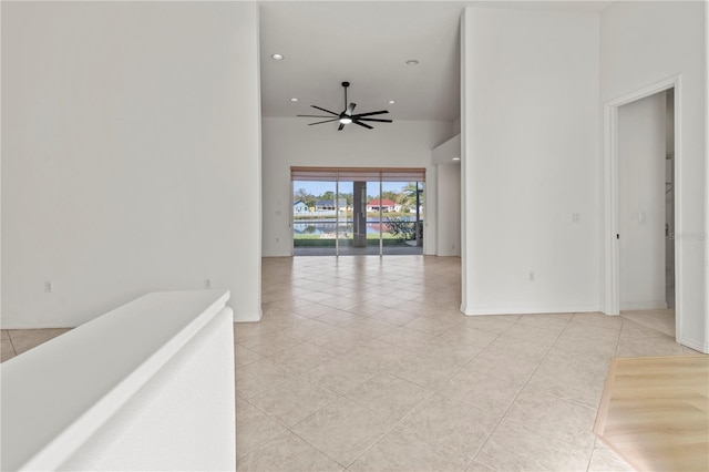 empty room with recessed lighting, light tile patterned flooring, and a ceiling fan