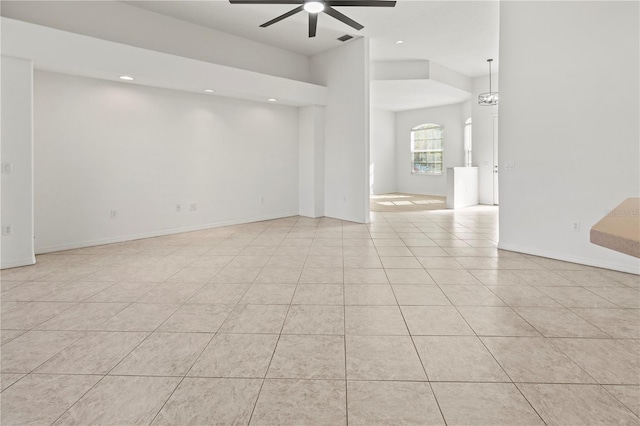 spare room featuring visible vents, baseboards, light tile patterned floors, recessed lighting, and a ceiling fan