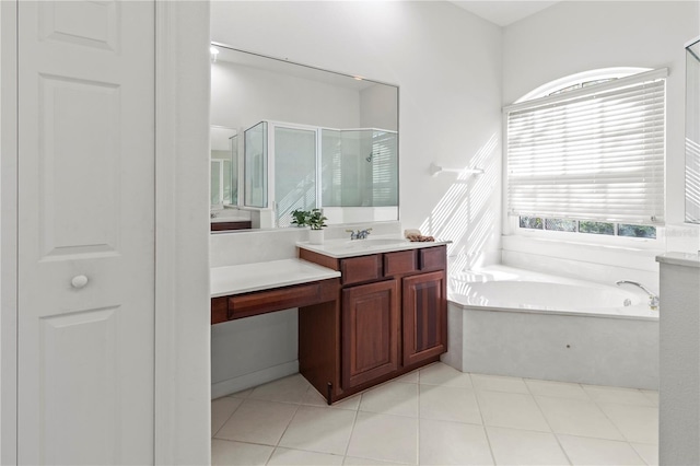 full bathroom featuring vanity, tile patterned floors, a bath, and a stall shower