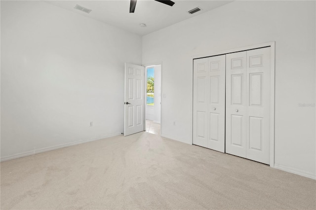 unfurnished bedroom with carpet flooring, ceiling fan, baseboards, and visible vents