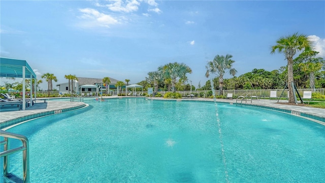 view of swimming pool featuring a patio and pool water feature