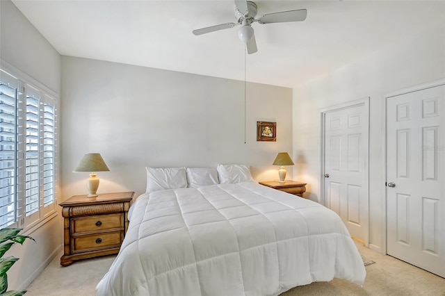 carpeted bedroom with ceiling fan