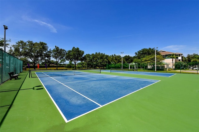 view of sport court featuring basketball hoop