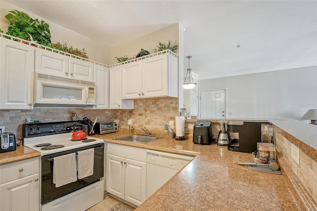 kitchen featuring sink, white appliances, decorative backsplash, white cabinets, and decorative light fixtures