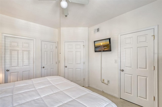 bedroom with light carpet and ceiling fan