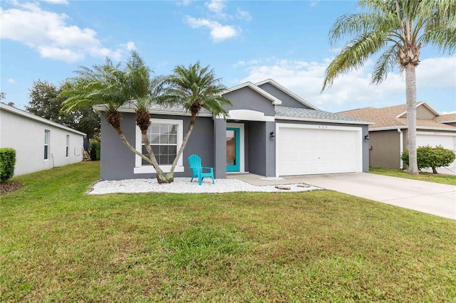 view of front of property featuring a garage and a front lawn