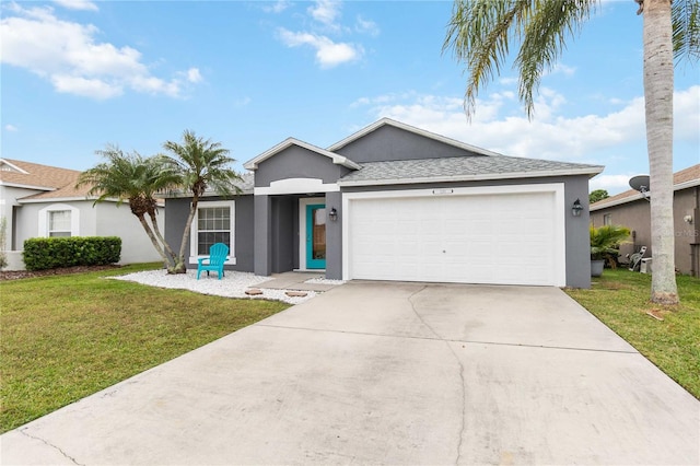 single story home featuring a garage and a front lawn