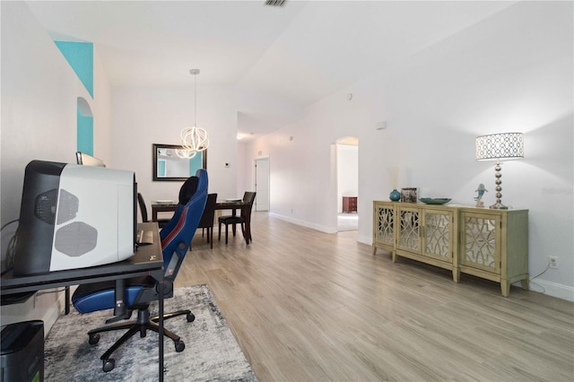 office featuring a chandelier and light wood-type flooring