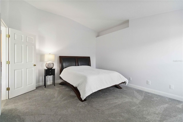 bedroom featuring carpet flooring and lofted ceiling