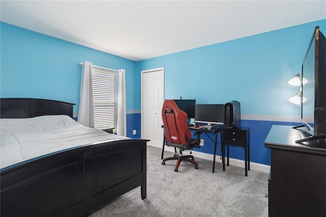 bedroom featuring light carpet