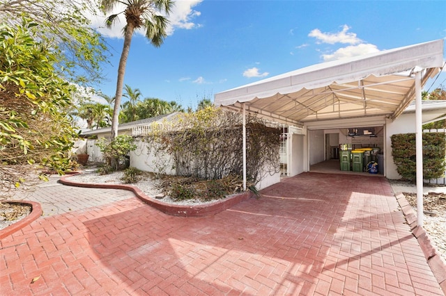 view of patio featuring a carport