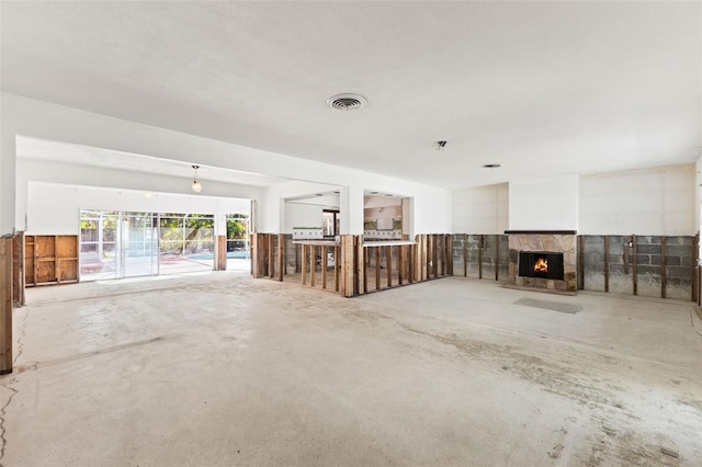 unfurnished living room featuring a fireplace