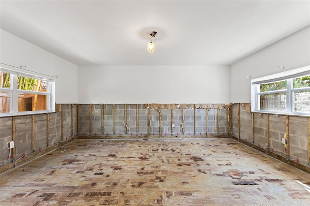 unfurnished room with tile walls