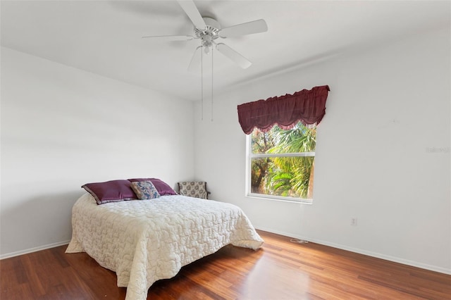 bedroom featuring ceiling fan and wood-type flooring