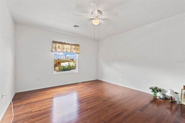 unfurnished room with ceiling fan and hardwood / wood-style flooring