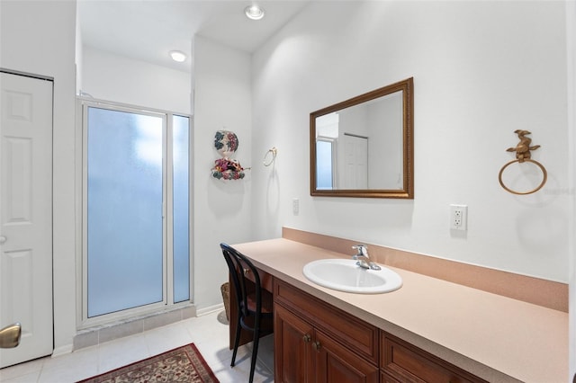 bathroom with tile patterned flooring, vanity, and a shower with shower door