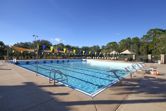 view of swimming pool featuring a patio area